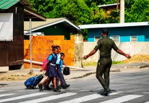 Local Vendor Hails D’Abadie School Crossing Guard as Community Hero