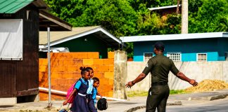 Local Vendor Hails D’Abadie School Crossing Guard as Community Hero