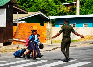 Local Vendor Hails D’Abadie School Crossing Guard as Community Hero