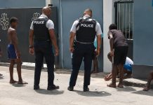Heartwarming Moment Captured as Police Engage with Youths in Game of Marbles
