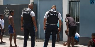 Heartwarming Moment Captured as Police Engage with Youths in Game of Marbles