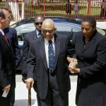 Opposition Leader Beckles Honors 1990 Coup Victims, Urges Vigilance for Democratic Future