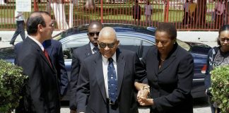 Opposition Leader Beckles Honors 1990 Coup Victims, Urges Vigilance for Democratic Future