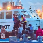Dozens rescued after Guyana ferry overturns, search continues.