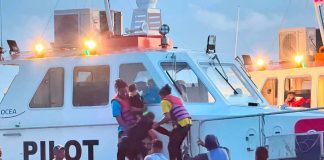 Dozens rescued after Guyana ferry overturns, search continues.