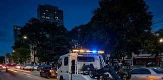 Motorists question towing as Independence activities increase city parking demand.
