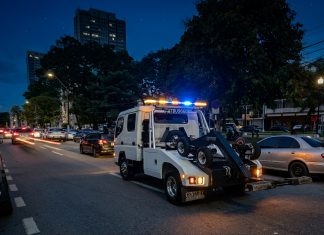 Motorists question towing as Independence activities increase city parking demand.