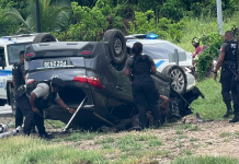 Dramatic Police Chase Ends with Vehicle Flipping on Beetham Highway