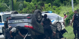 Dramatic Police Chase Ends with Vehicle Flipping on Beetham Highway