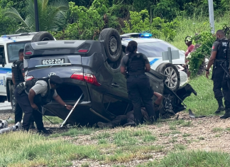 Dramatic Police Chase Ends with Vehicle Flipping on Beetham Highway