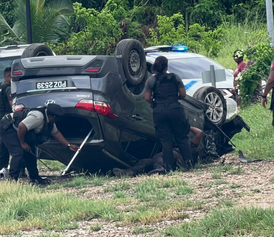 Dramatic Police Chase Ends with Vehicle Flipping on Beetham Highway