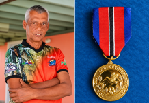 Vallence Rambharat receives Hummingbird Gold for volunteer rescue service