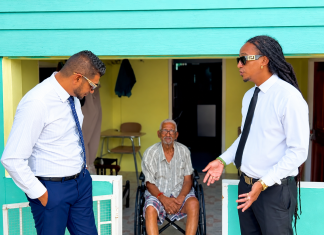 Alibocas, Premchand Deliver Wheelchair to Corinth Resident
