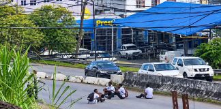 Schoolchildren filmed taking dangerous pictures while sitting on busy roadway