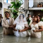 Bride and Groom Marry at Flooded Church Despite Rising Dangers