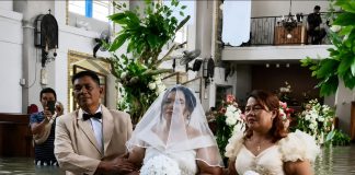 Bride and Groom Marry at Flooded Church Despite Rising Dangers