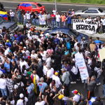 Caracas demonstrators rally after Machado blocked from returning to Venezuela