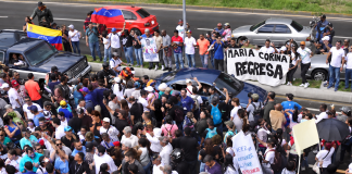 Caracas demonstrators rally after Machado blocked from returning to Venezuela