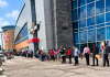 Huge Line Of Job Seekers Stretches Along Building As Large Crowd Searches For Work