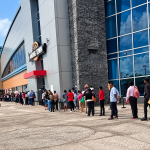 Huge Line Of Job Seekers Stretches Along Building As Large Crowd Searches For Work