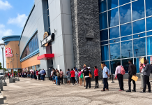 Huge Line Of Job Seekers Stretches Along Building As Large Crowd Searches For Work