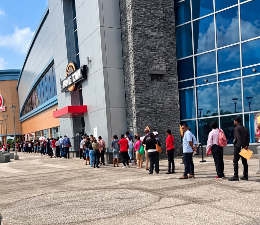 Huge Line Of Job Seekers Stretches Along Building As Large Crowd Searches For Work