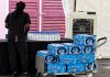Unlabelled water bottles spark controversy over alleged politically motivated instructions.