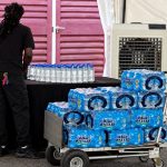Unlabelled water bottles spark controversy over alleged politically motivated instructions.