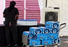 Unlabelled water bottles spark controversy over alleged politically motivated instructions.