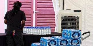 Unlabelled water bottles spark controversy over alleged politically motivated instructions.