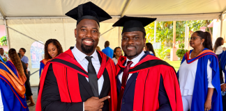 Two schoolmates celebrate doctorates twenty-two years after leaving Gasparillo Composite.