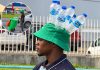 Piarco Water Vendor Gets Attention With Creative Bottle Hat